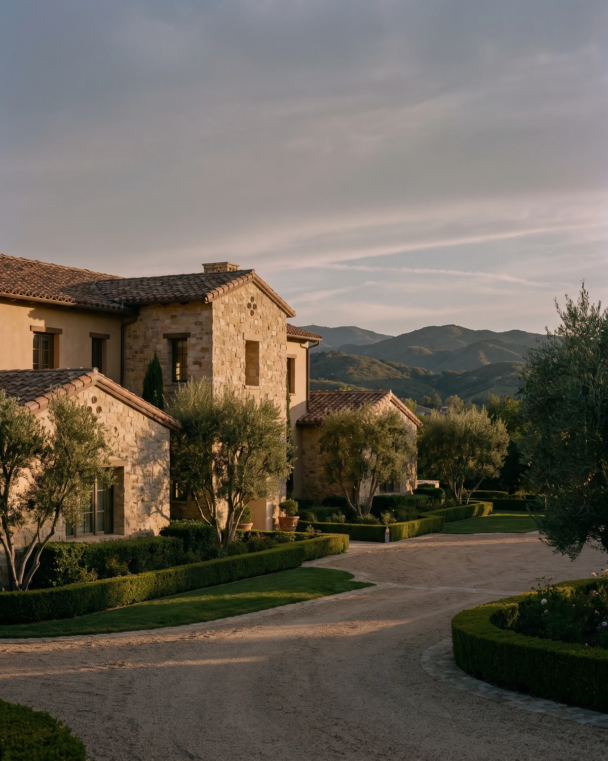 Stone Calabasas home with olive trees and mountain views
