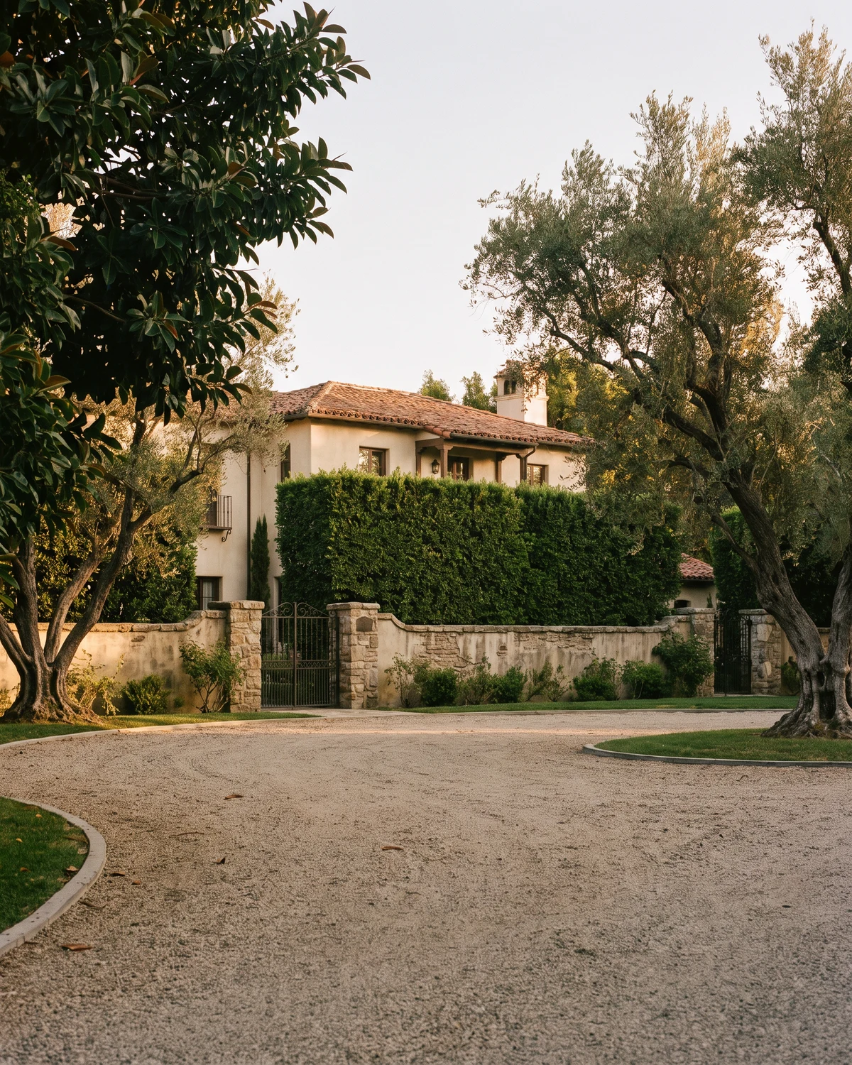 Mediterranean-style Encino home framed by mature olive trees