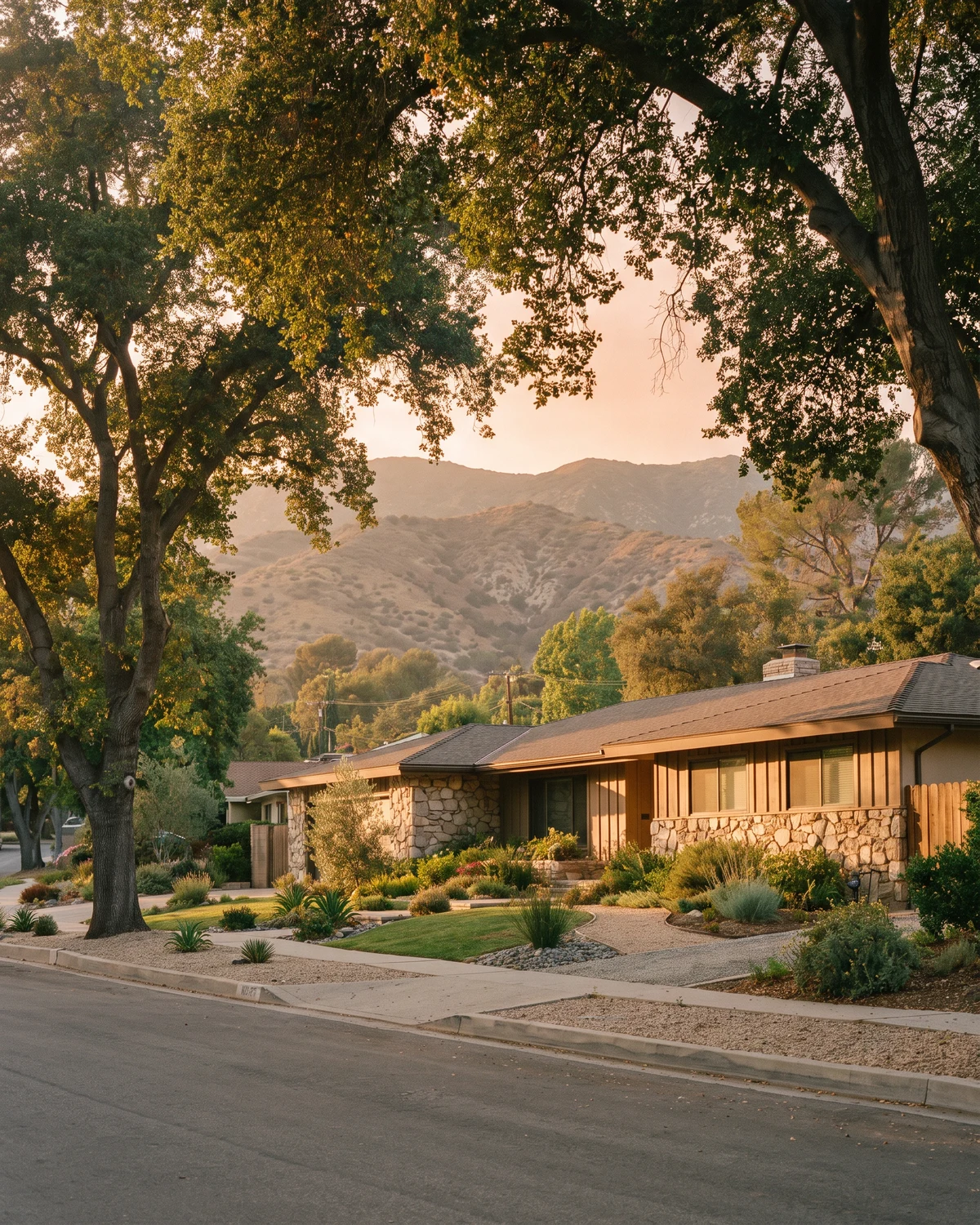 Tree-lined Granada Hills street with mountain foothills beyond