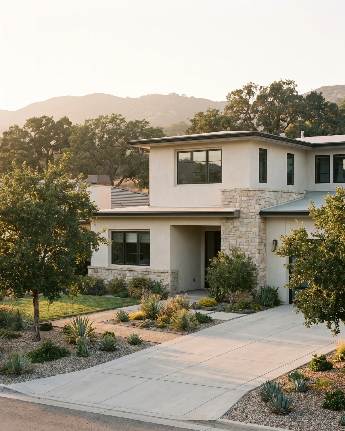 Modern Santa Clarita two-story home with stone accents and oak hills behind